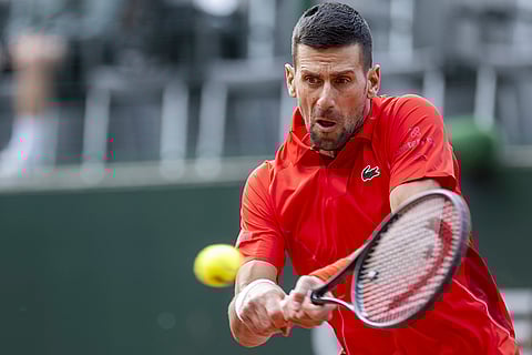 Serbia's Djokovic returns a ball to Tallon Griekspoor